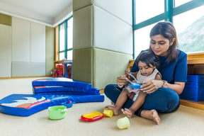 Indian mother play with her daughter at home